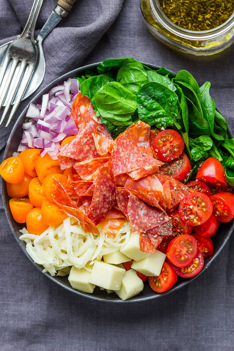 Spinach Salad with Mozzarella, Tomato & Pepperoni - Healthy and delicious, this spinach salad is so simple and perfect for a quick lunch.
