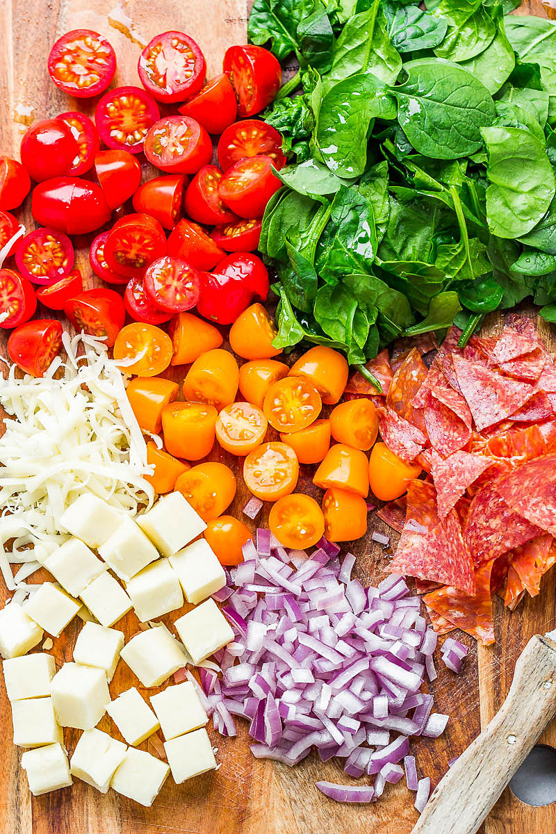 Spinach Salad with Mozzarella, Tomato & Pepperoni - Healthy and delicious, this spinach salad is so simple and perfect for a quick lunch.