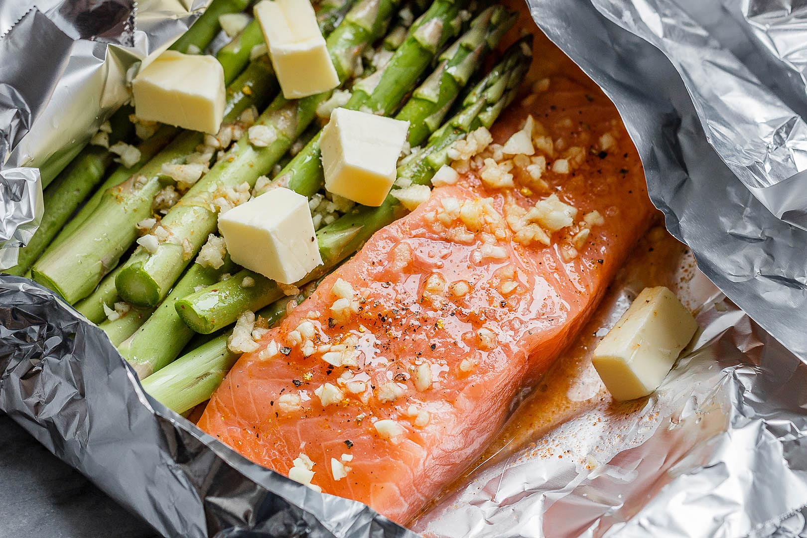 Baked Salmon in Foil with Asparagus and Garlic Butter Sauce Baked