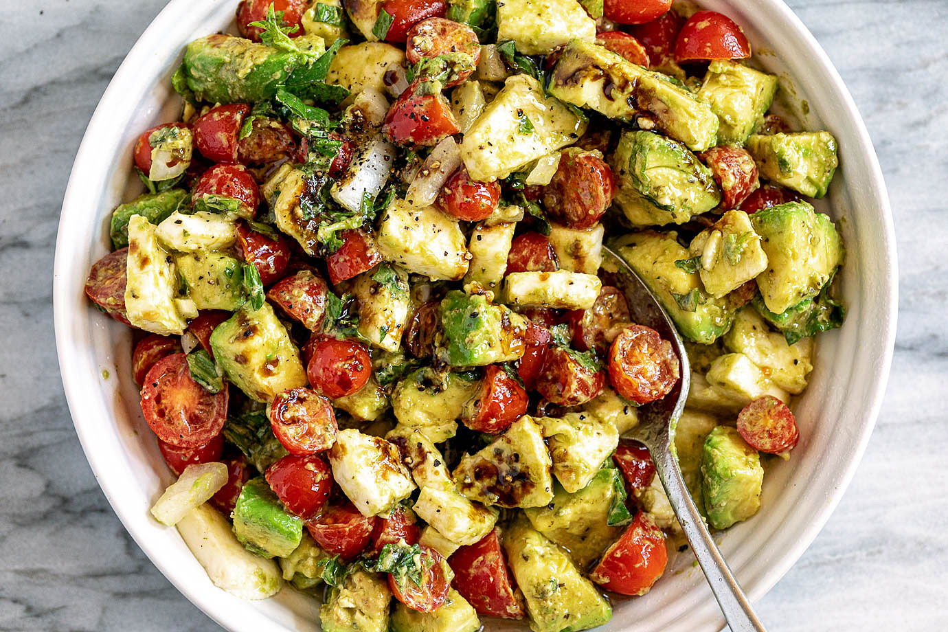 Caprese Avocado Salad with Mozzarella, Pesto, Tomato, and Balsamic