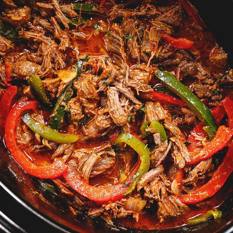 Slow Cooker Flank Steak and Peppers - Deliciously Seasoned