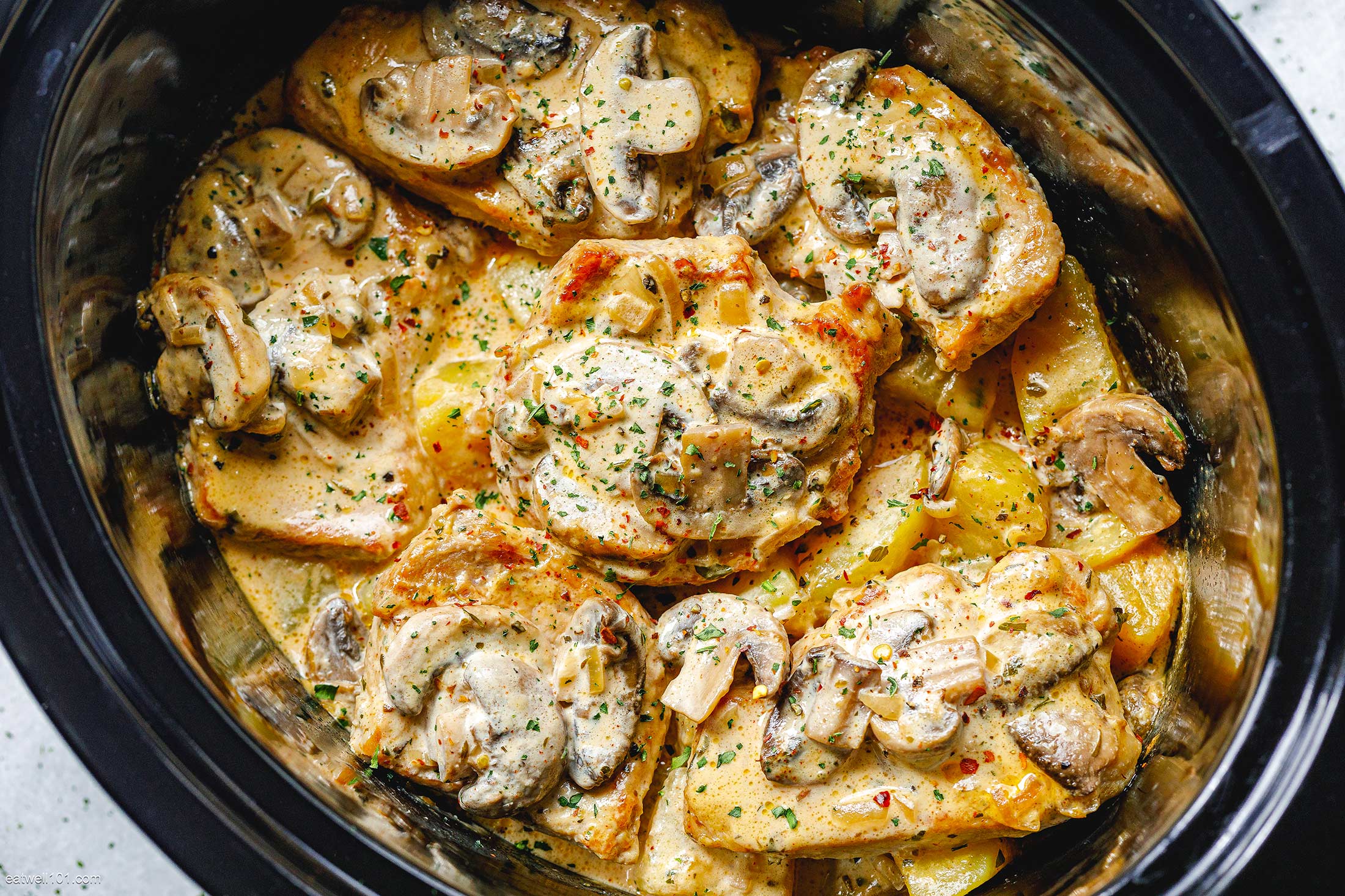 Creamy Garlic Pork Chops Recipe With Mushrooms And Potatoes Crockpot Pork Chops Recipe Eatwell101