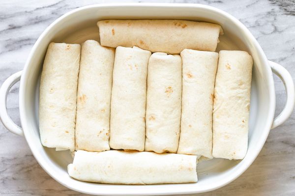 Creamy White Chicken Enchiladas Casserole