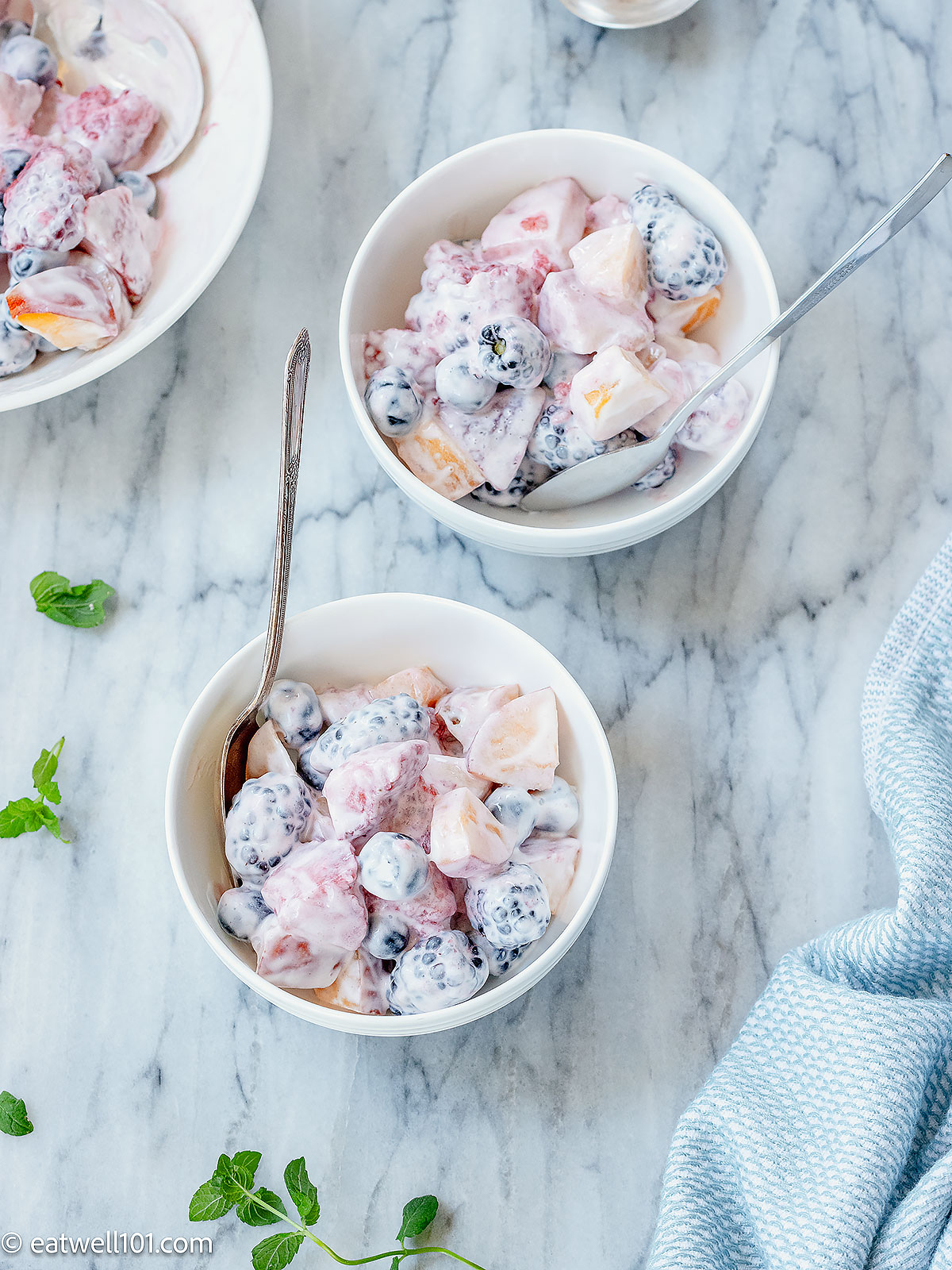 creamy fruit salad in bowls