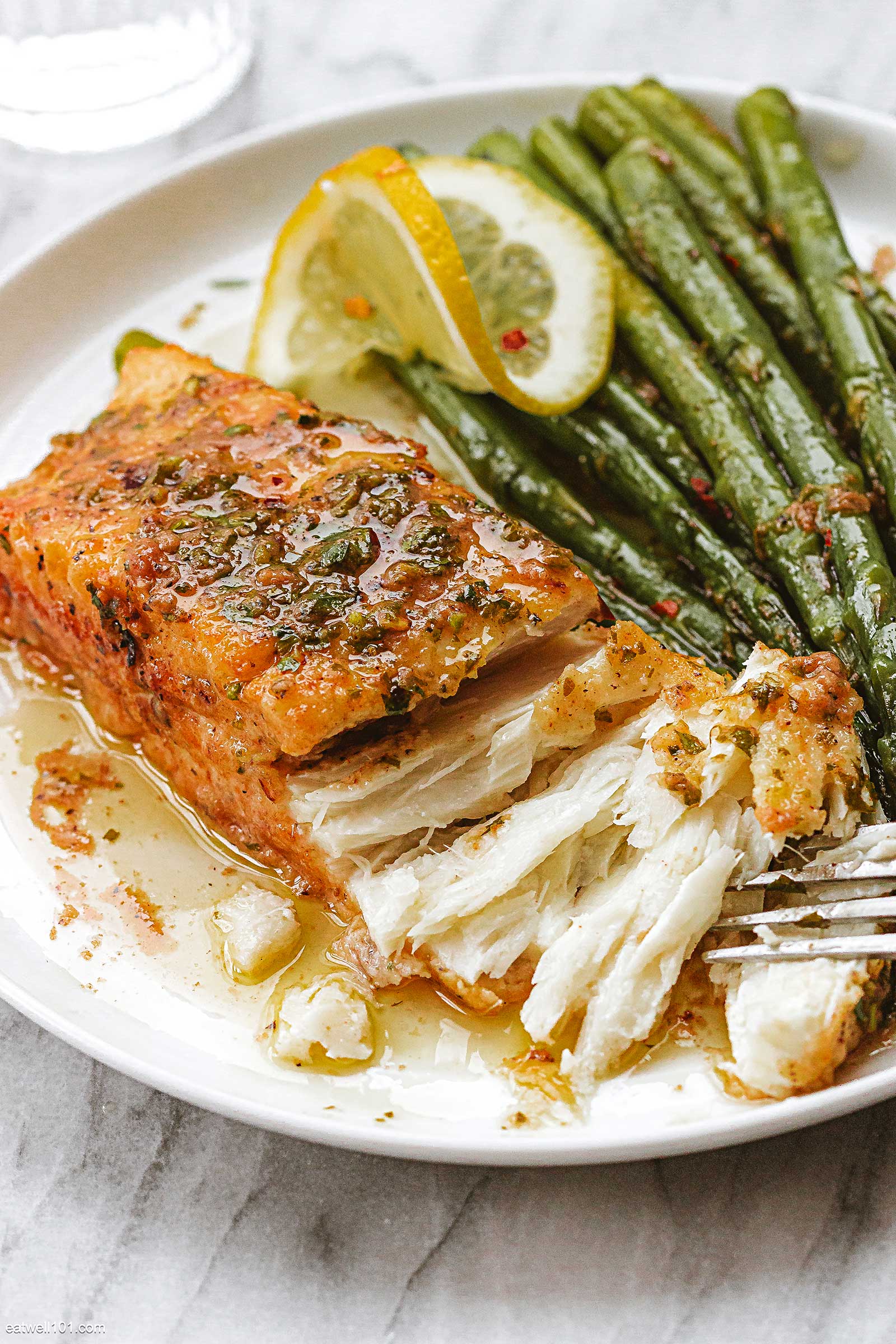 halibut and asparagus dinner in a plate