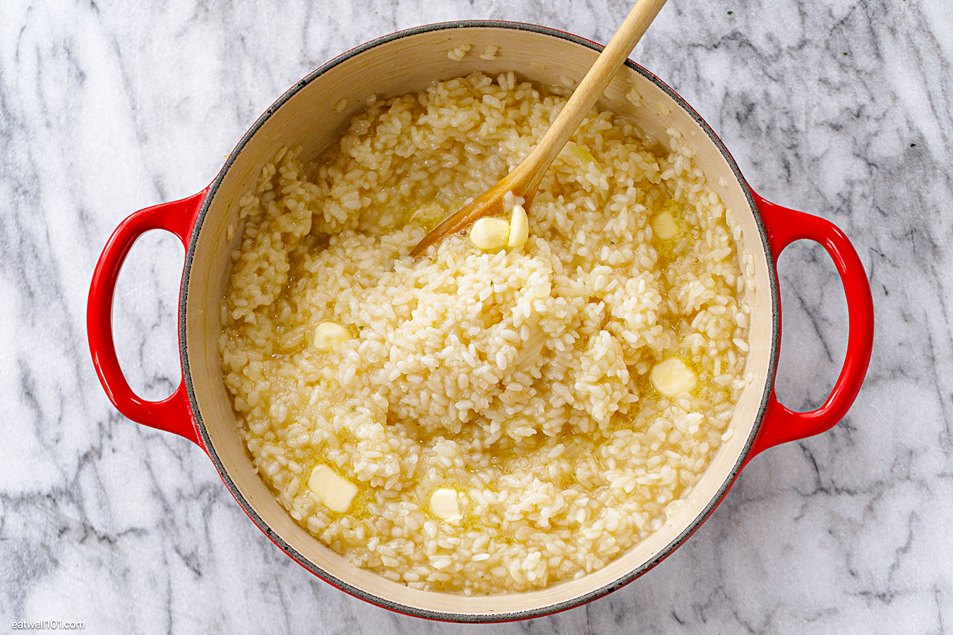 stirring risotto in a pot