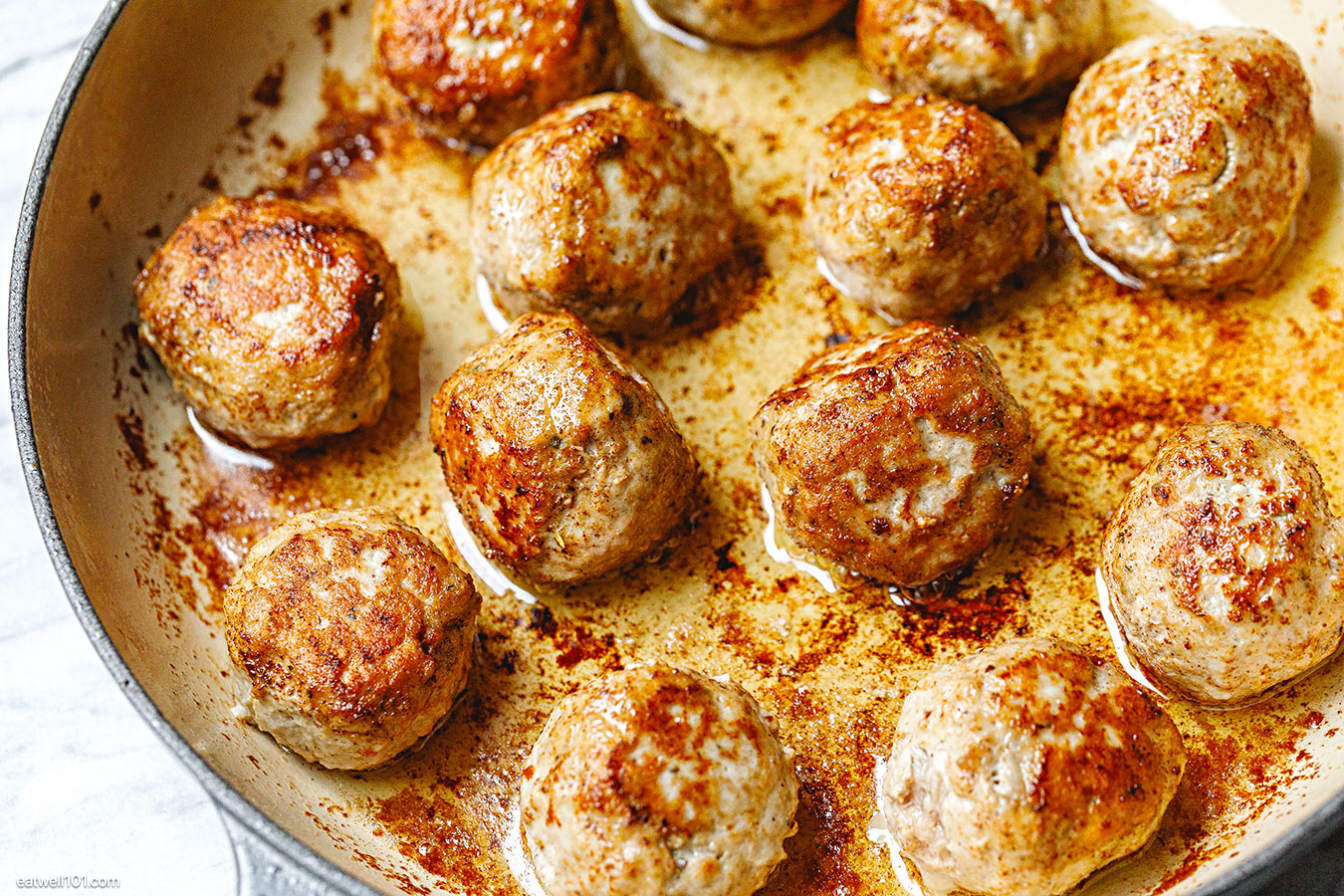 turkey meatballs cooking in a skillet