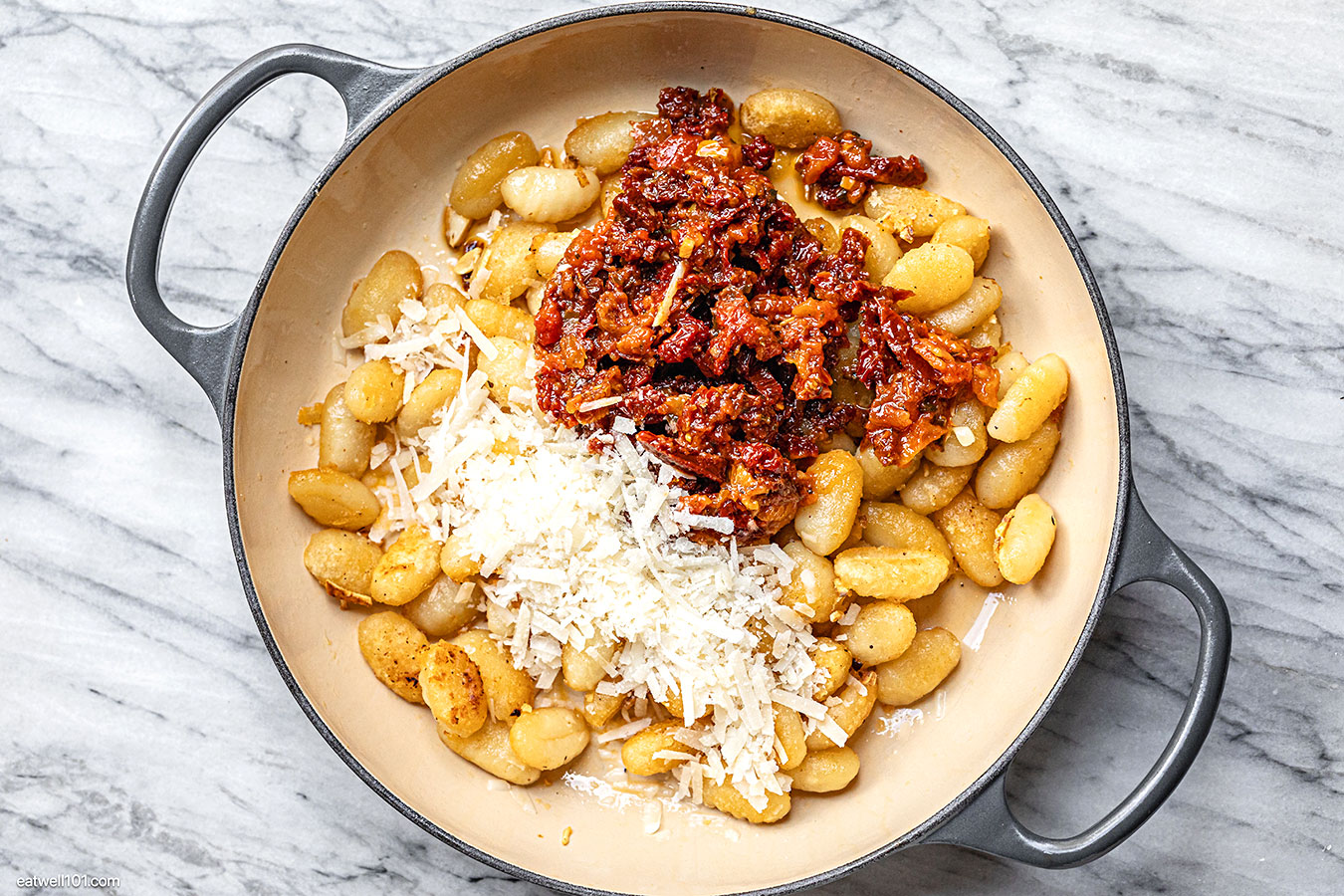 gnocchi parmesan and sundried tomatoes in the skillet