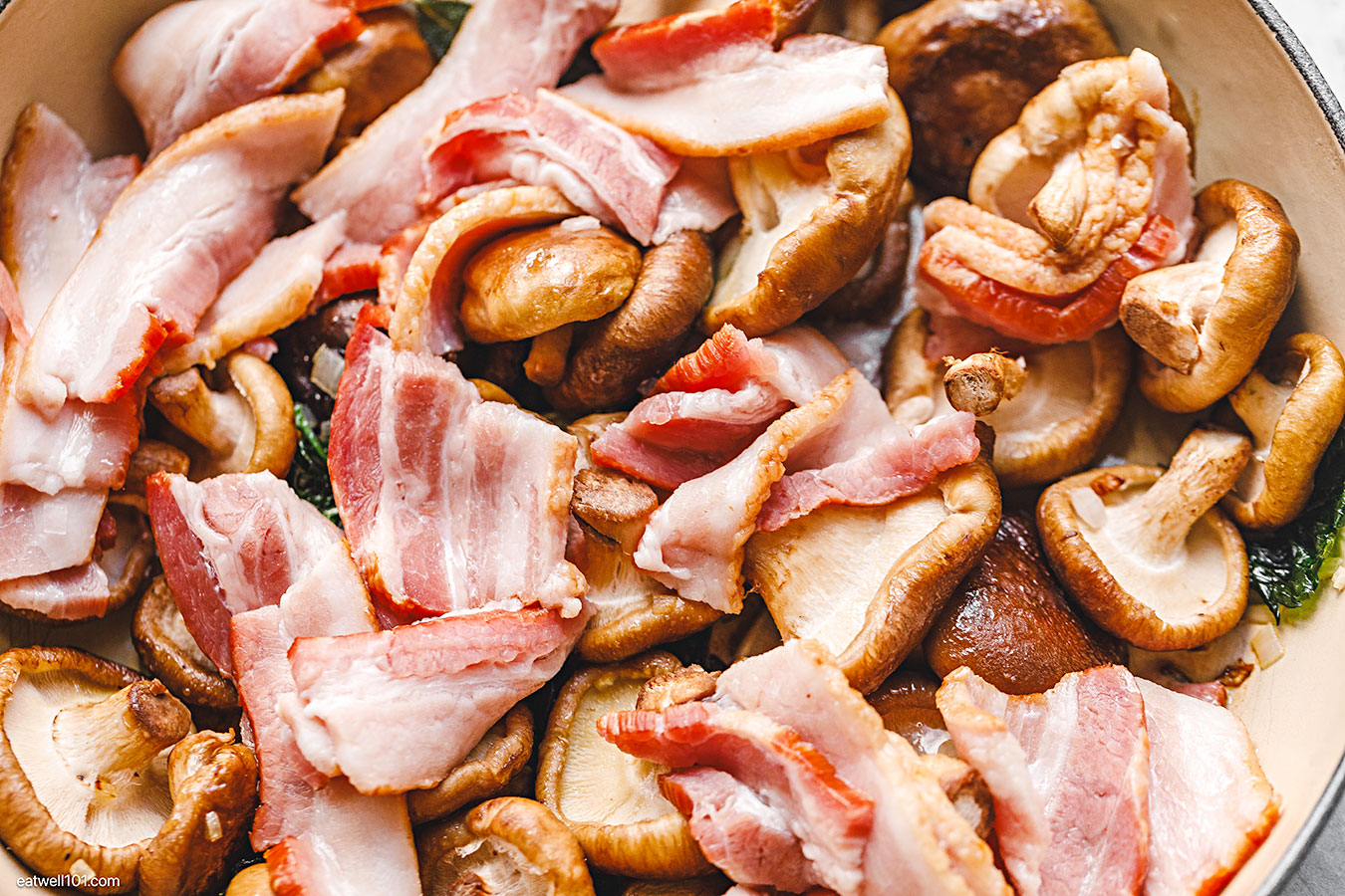 bacon and mushroom sauteed in a pan