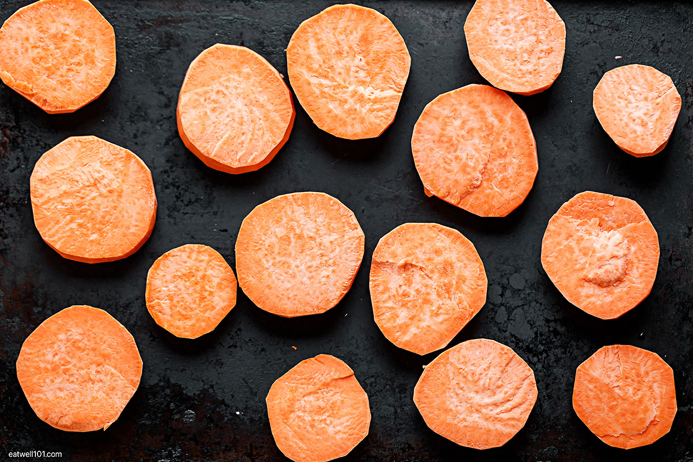 sweet potato slices on a baking sheet