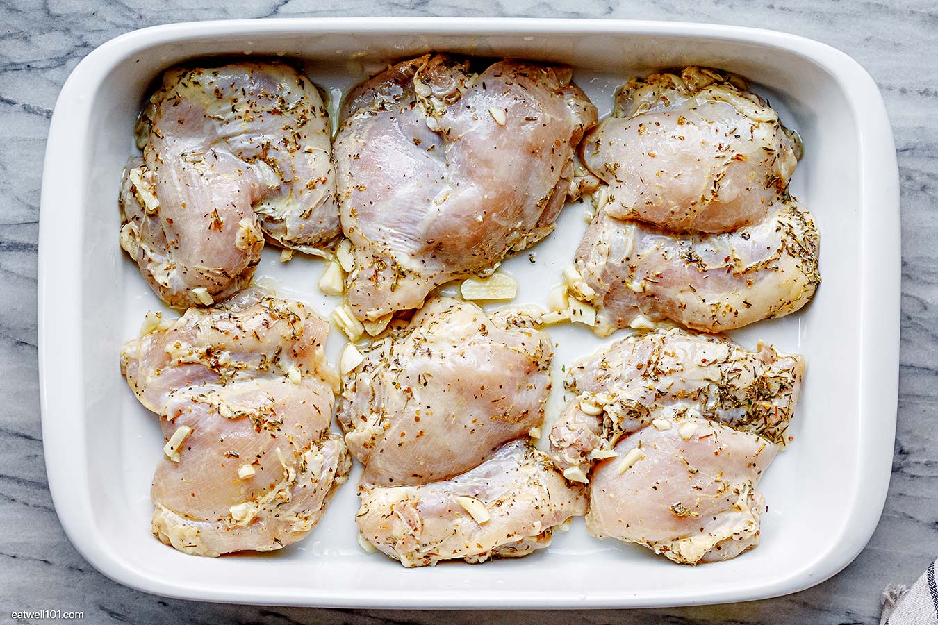 marinated chicken thighs in a baking dish