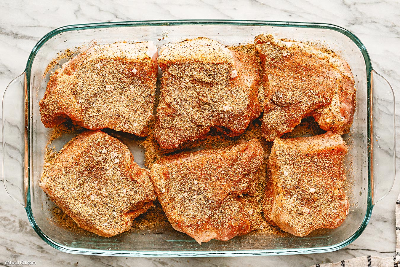 pork chops in baking dish with spice