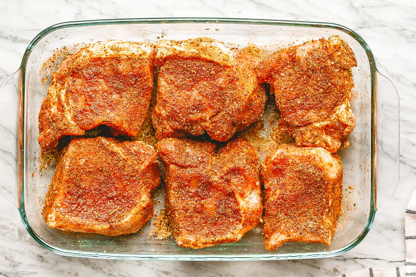 seasoned pork chops in baking dish