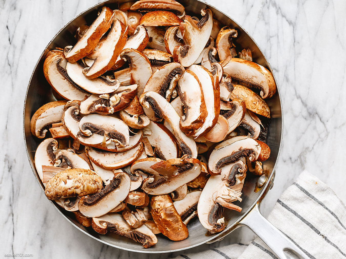 sliced mushrooms in a pan